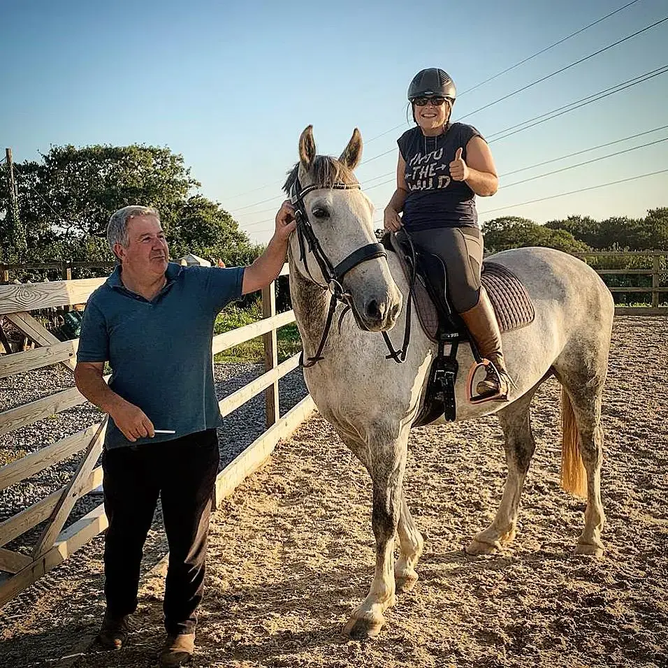 Huw Thomas checking a saddle fit during an arena clinic